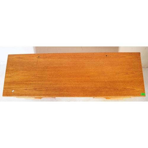 623 - Stonehill - A retro mid 20th century light oak kneehole desk. The desk having central kneehole flank... 