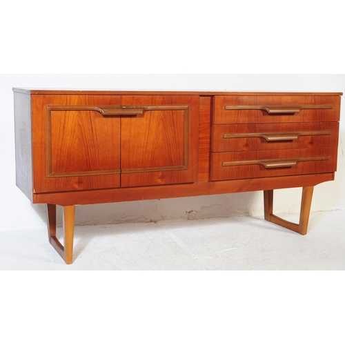 627 - British Modern Design - A retro mid 20th century teak sideboard. The sideboard having a bank of thre... 