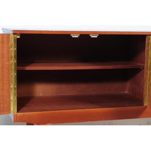 627 - British Modern Design - A retro mid 20th century teak sideboard. The sideboard having a bank of thre... 