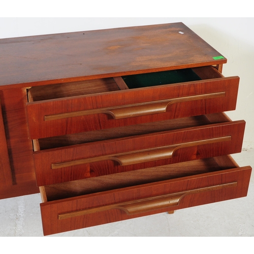 627 - British Modern Design - A retro mid 20th century teak sideboard. The sideboard having a bank of thre... 