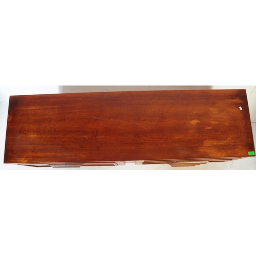 627 - British Modern Design - A retro mid 20th century teak sideboard. The sideboard having a bank of thre... 