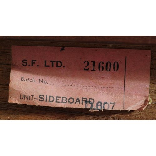 627 - British Modern Design - A retro mid 20th century teak sideboard. The sideboard having a bank of thre... 