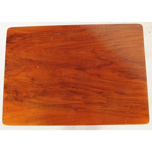 660 - A contemporary teak wood graduating nest of tables of Danish influence. Each nesting table raised on... 