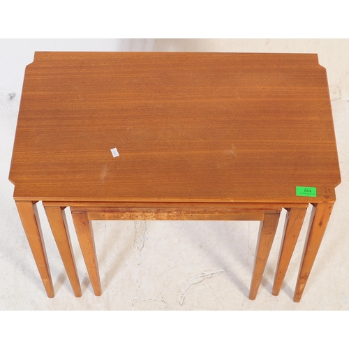 664 - A mid 20th century walnut nest of tables. Of rectangular form with shaped corners, square tapering. ... 