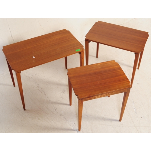 664 - A mid 20th century walnut nest of tables. Of rectangular form with shaped corners, square tapering. ... 