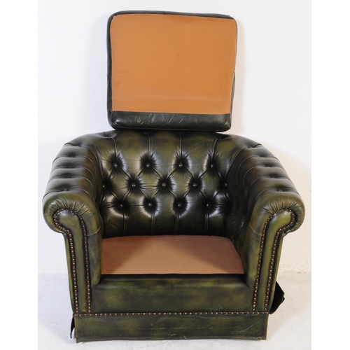 669 - A late 20th century button backed three seater sofa settee couch with arm chair in a chesterfield st... 