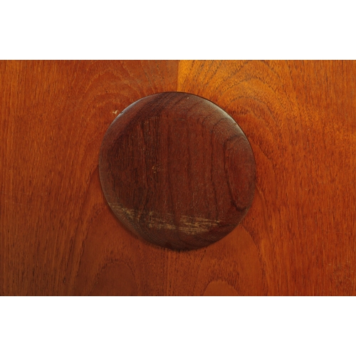 671 - A retro mid 20th century teak sideboard credenza by Beautility. Of rectangular form with a bank of t... 