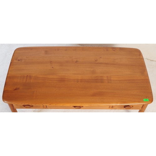 679 - Ercol - Windsor - A retro mid 20th century circa 1960s blond elm occasional coffee table. The table ... 