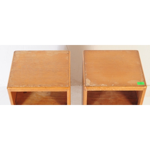 680 - British Modern Design - A pair of mid 20th century circa 1950s post-war teak bedside cabinets raised... 