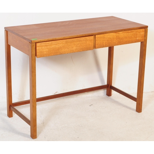 681 - British Modern Design - A mid 20th century teak writing desk / side table. The desk having twin draw... 