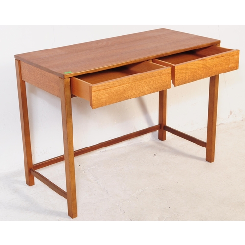 681 - British Modern Design - A mid 20th century teak writing desk / side table. The desk having twin draw... 