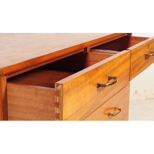 682 - British Modern Design - A mid 20th century circa 1960s teak chest of drawers. The chest of drawers h... 