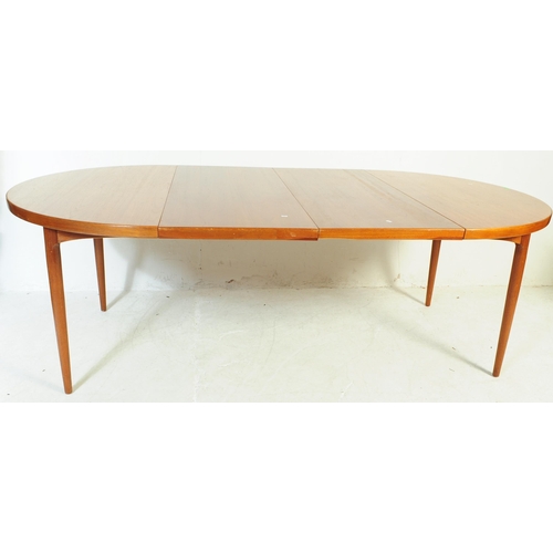 688 - Danish Modern Design - Mid century dining room table and chairs. The suite comprising an extending d... 