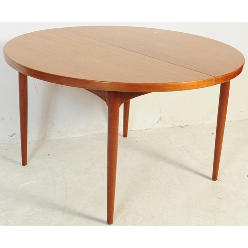 688 - Danish Modern Design - Mid century dining room table and chairs. The suite comprising an extending d... 