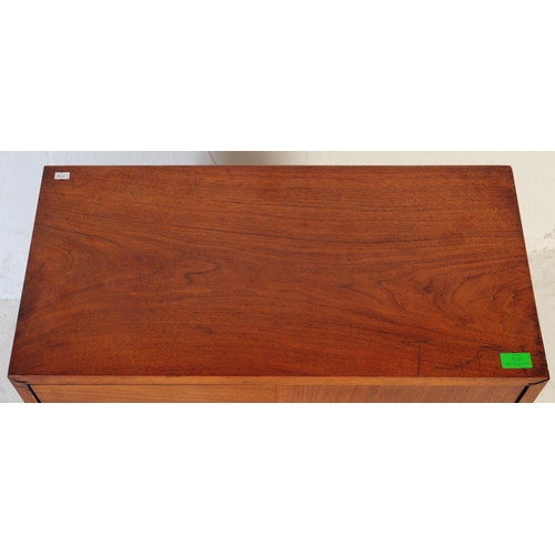 689 - A mid century walnut twin door filing cabinet. The desk raised on a plinth base with pedestal having... 