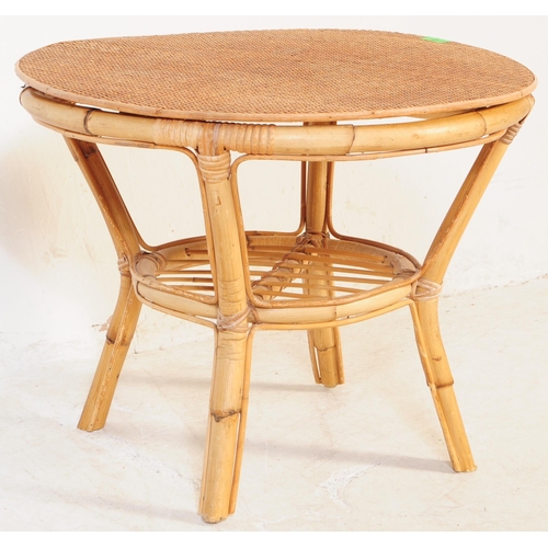 691 - A retro 20th century bamboo and cane suite. The set comprising a two seater sofa, two armchairs and ... 