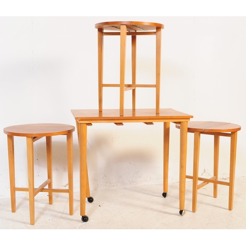 699 - A retro mid 20th century Danish inspired teak nest of table. Poul Hundevad manner. Rectangular form ... 