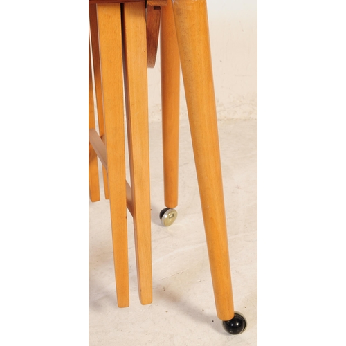 699 - A retro mid 20th century Danish inspired teak nest of table. Poul Hundevad manner. Rectangular form ... 