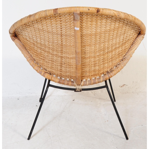 715 - A pair of retro 20th Century wicker cane satellite chairs in the manner of Franco Albini. The circle... 