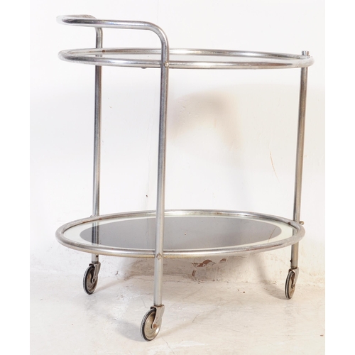 606 - A 1930's Art Deco chrome butlers cocktail hostess serving trolley. Tubular chrome frame on castors h... 