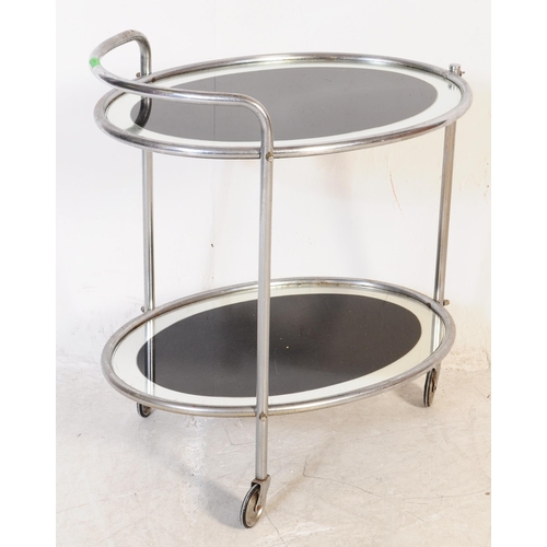 606 - A 1930's Art Deco chrome butlers cocktail hostess serving trolley. Tubular chrome frame on castors h... 
