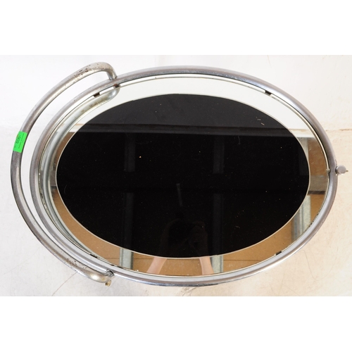 606 - A 1930's Art Deco chrome butlers cocktail hostess serving trolley. Tubular chrome frame on castors h... 