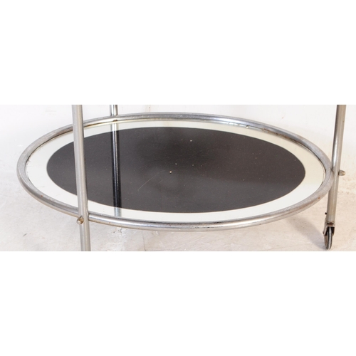 606 - A 1930's Art Deco chrome butlers cocktail hostess serving trolley. Tubular chrome frame on castors h... 