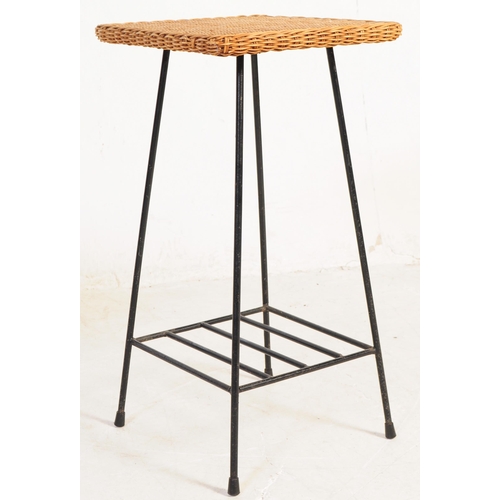 608 - Two vintage 20th century wicker side tables, each having wicker tops and being raises over tubular b... 