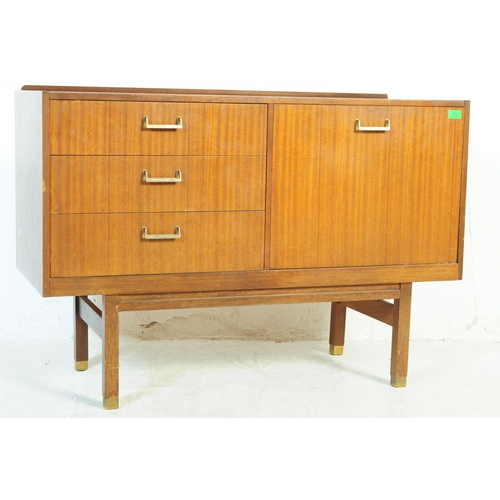 645 - A retro mid 20th Century British design teak wood sideboard credenza having a bank of three drawers ... 