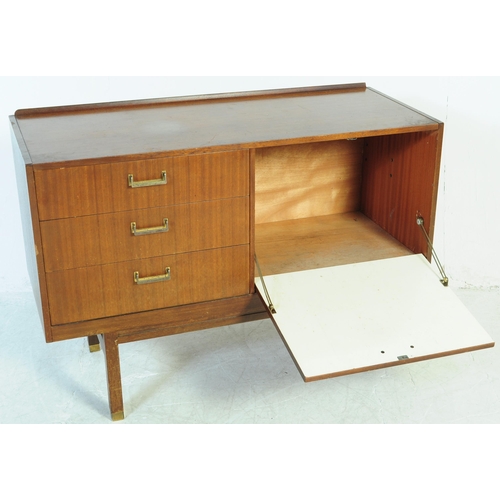 645 - A retro mid 20th Century British design teak wood sideboard credenza having a bank of three drawers ... 