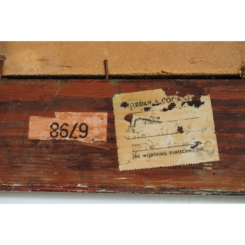 656 - A 20th century silvered and green painted frame mirror. The mirror with cushioned frame having a sil... 