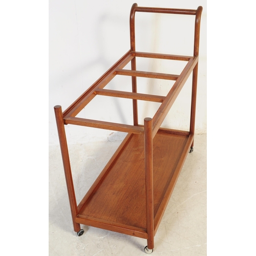 693 - A mid 20th century Danish inspired teak butlers serving hostess trolley. The trolley having shaped h... 
