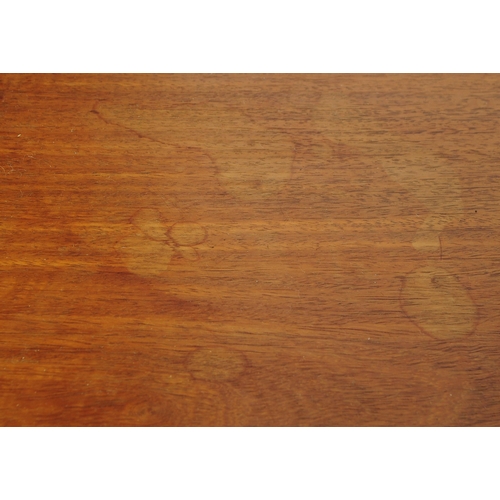 693 - A mid 20th century Danish inspired teak butlers serving hostess trolley. The trolley having shaped h... 