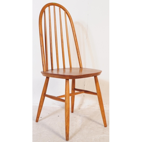 702 - A pair of mid 20th century vintage beech and elm dining / kitchen chairs. In the manner of Ercol Qua... 