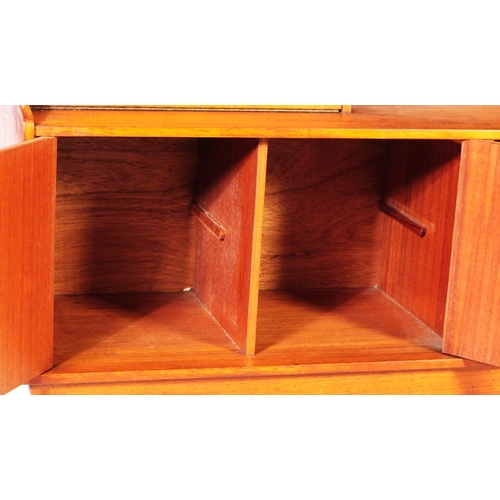 635 - Elliotts of Newbury - A mid 20th century retro teak higboard / sideboard. Having a pull down door ca... 