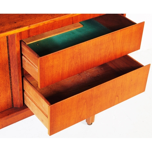 635 - Elliotts of Newbury - A mid 20th century retro teak higboard / sideboard. Having a pull down door ca... 