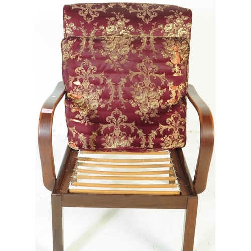647 - Parker Knoll - A mid 20th century lounge easy armchair. Model number 714, with purple upholstered cu... 