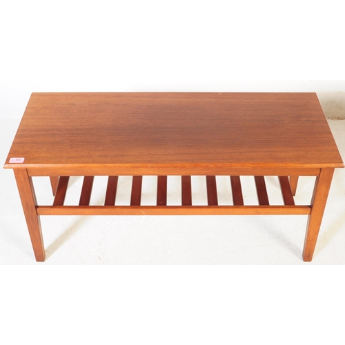 650 - Herbert Gibbs - A vintage mid 20th century teak coffee table. Rectangular form with flared top above... 