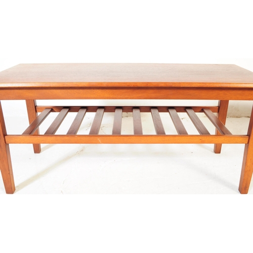 650 - Herbert Gibbs - A vintage mid 20th century teak coffee table. Rectangular form with flared top above... 