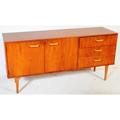 659 - British Modern Design - A mid 20th century teak wood sideboard credenza. Of rectangular form  compri... 