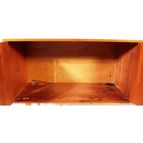 659 - British Modern Design - A mid 20th century teak wood sideboard credenza. Of rectangular form  compri... 