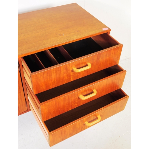 659 - British Modern Design - A mid 20th century teak wood sideboard credenza. Of rectangular form  compri... 