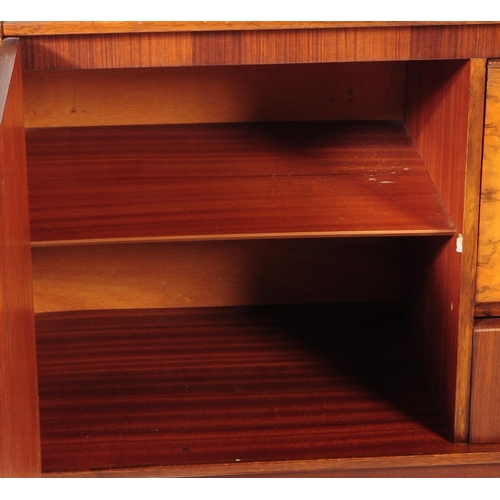 663 - British Modern Design - A mid 20th century circa 1960's / 1960 teak and walnut credenza sideboard. T... 