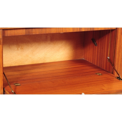 663 - British Modern Design - A mid 20th century circa 1960's / 1960 teak and walnut credenza sideboard. T... 