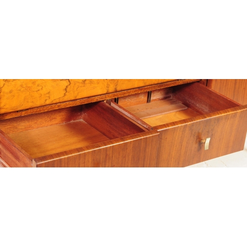 663 - British Modern Design - A mid 20th century circa 1960's / 1960 teak and walnut credenza sideboard. T... 