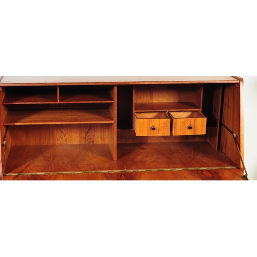 665 - Burolite Furniture - A mid 20th Century teak Burolite bureau desk. With fall front panel enclosing f... 