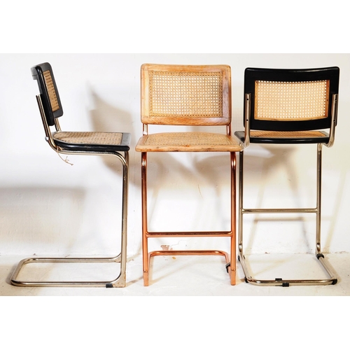 670 - A set of three retro 20th century oak & rose gold chrome cantilever chairs. Each chair having oak se... 