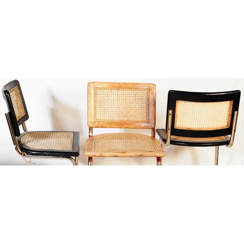 670 - A set of three retro 20th century oak & rose gold chrome cantilever chairs. Each chair having oak se... 