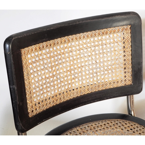 670 - A set of three retro 20th century oak & rose gold chrome cantilever chairs. Each chair having oak se... 