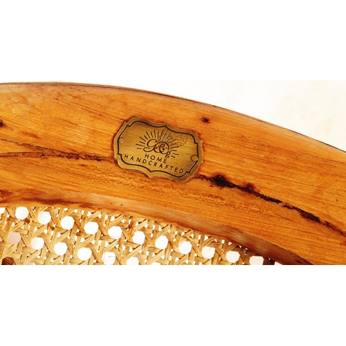 670 - A set of three retro 20th century oak & rose gold chrome cantilever chairs. Each chair having oak se... 